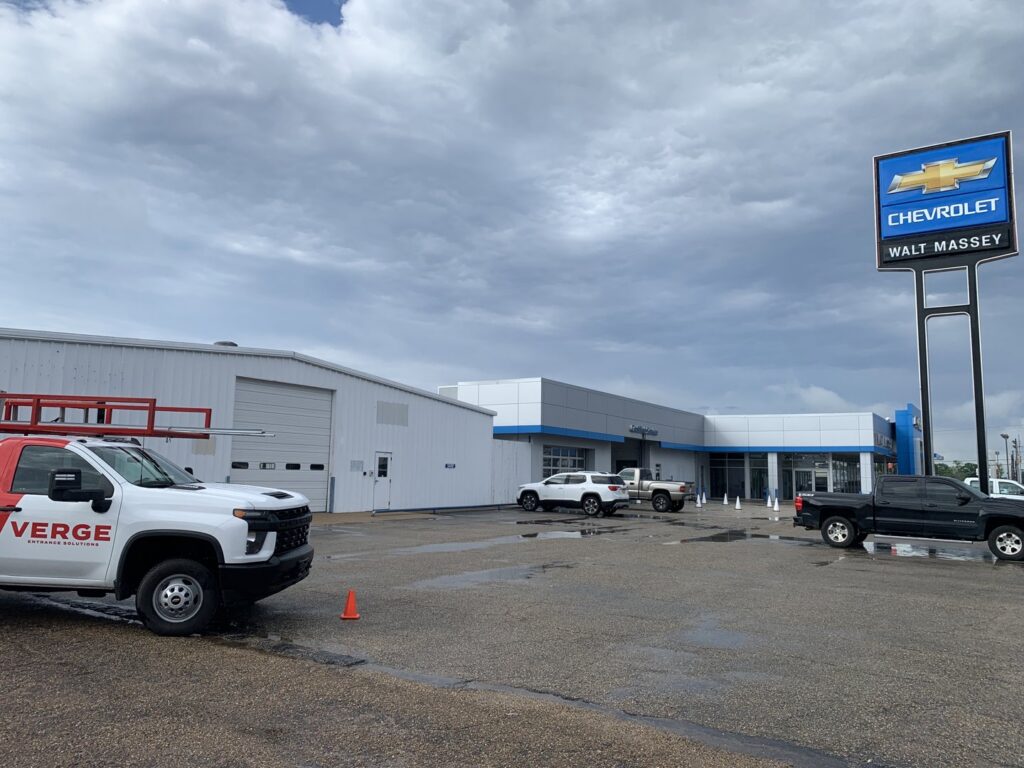 A Verge Entrance Solutions truck at a commercial garage door service job in Hattiesburg, MS.