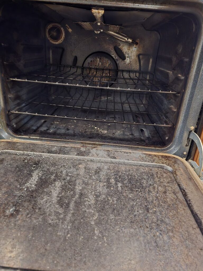A very dirty oven interior before deep cleaning by Wonderful Laura Cleaning in Aurora, IL.