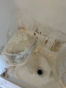 Dirty shower stall with grime and mildew before professional cleaning by We Maid It Two Cleaning Services LLC in Owensboro, KY.