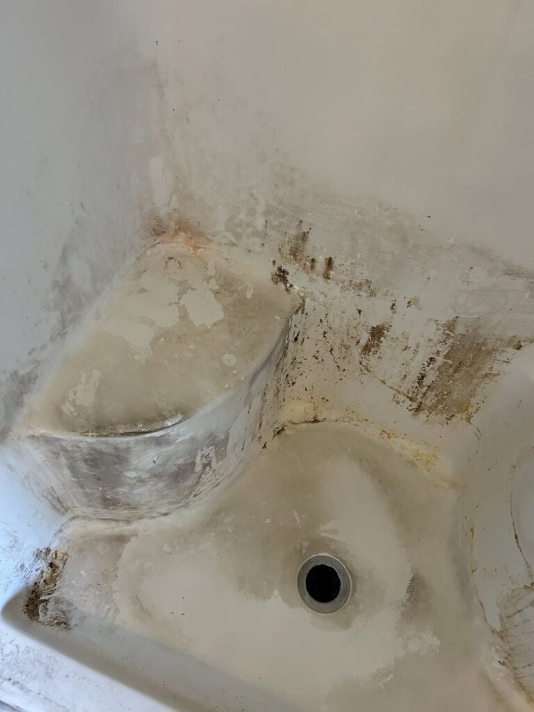 Dirty shower stall with grime and mildew before professional cleaning by We Maid It Two Cleaning Services LLC in Owensboro, KY.