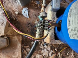 Wall with drywall removed for water damage remediation, showing exposed studs and pipes by Affordable Plumbing Expert in Edmond, OK
