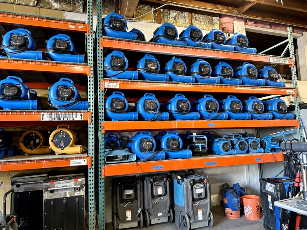 Warehouse shelves stocked with water damage drying equipment at Central Oregon Disaster Restoration in Bend, OR.