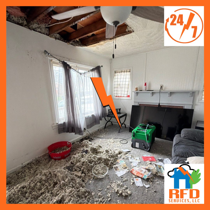 A room with a damaged ceiling and insulation on the floor, showing water damage cleanup by RFD Services in Akron, OH.