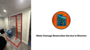 A room with plastic sheeting containment and an air mover for water damage restoration by Utah Flood Guys in Sandy, UT.