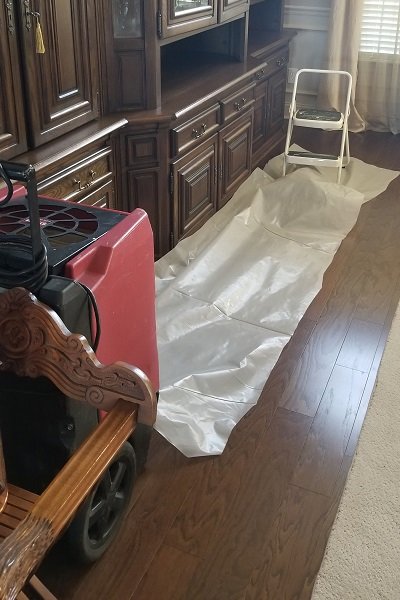 A dehumidifier used for water damage drying in a home by ABC Cleaning and Restoration in Harvest, AL.