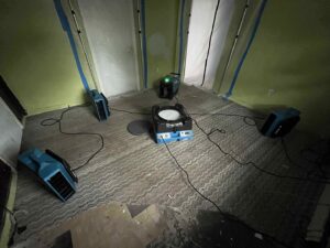 Multiple air movers and containment barriers set up for water damage drying by RestoPros of Hartford in West Hartford, CT.