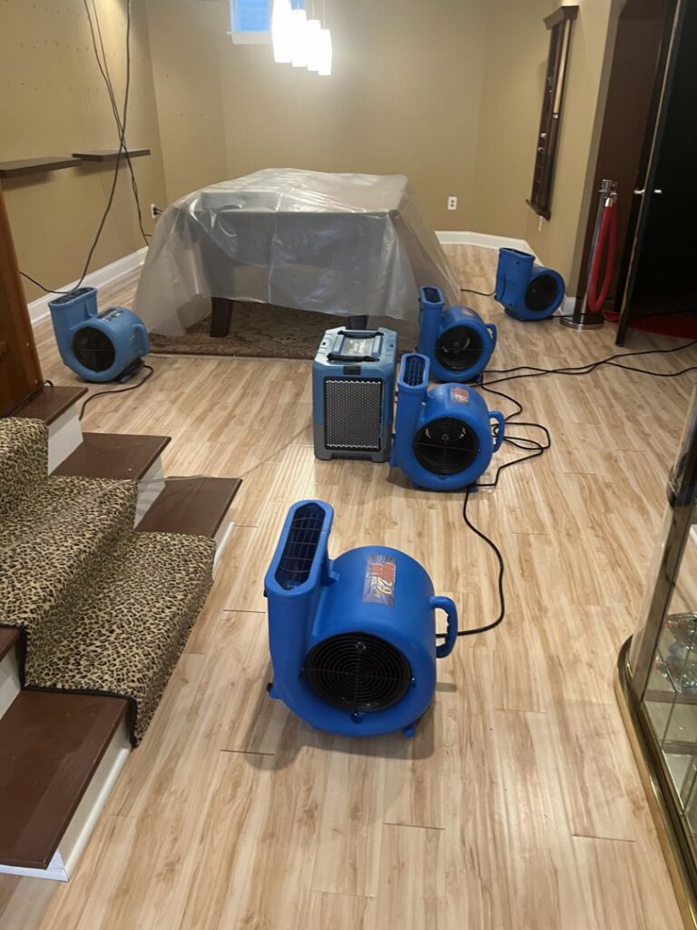 Professional water damage drying equipment, including air movers and dehumidifiers, used by Acclaim Restoration in Harrisburg, PA