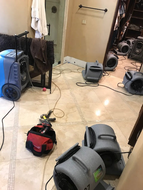 Water damage drying equipment, air movers, and dehumidifiers, in a bathroom by Best Dry Flood and Mold Specialists, Inc. San Diego, CA