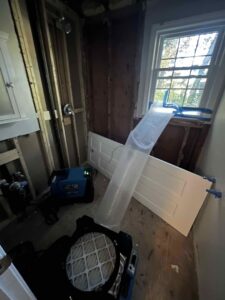 Water damage drying equipment and exposed studs in a bathroom during remediation by RestoPros of Hartford in West Hartford, CT.
