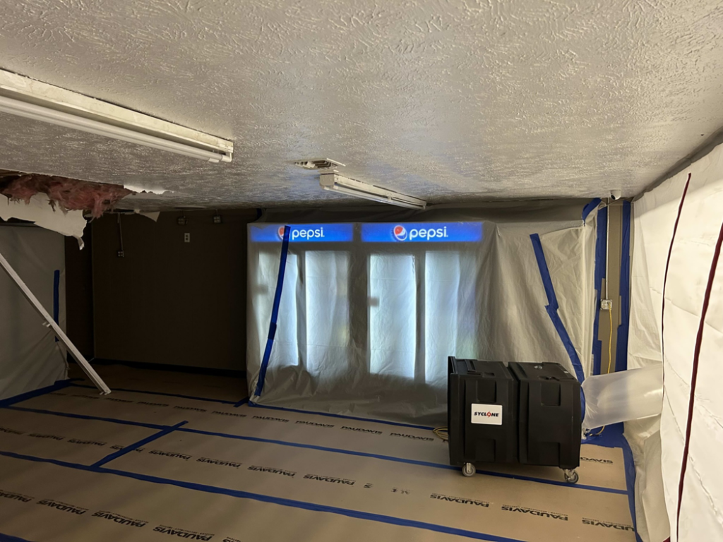 Drying equipment and plastic containment in a room during water damage restoration by Paul Davis of Eastern Ohio in Youngstown, OH.