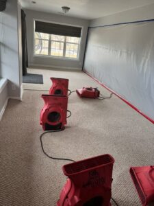 Water damage drying equipment and containment barriers set up in a home by Property Doctors, Inc. in Denver, CO.