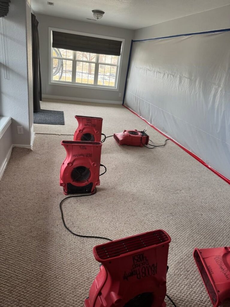 Water damage drying equipment and containment barriers set up in a home by Property Doctors, Inc. in Denver, CO.