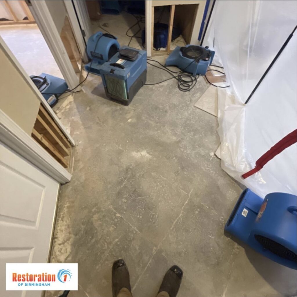 Water damage drying equipment and containment barrier set up in a home by Restoration 1 of Birmingham in Pelham, AL.