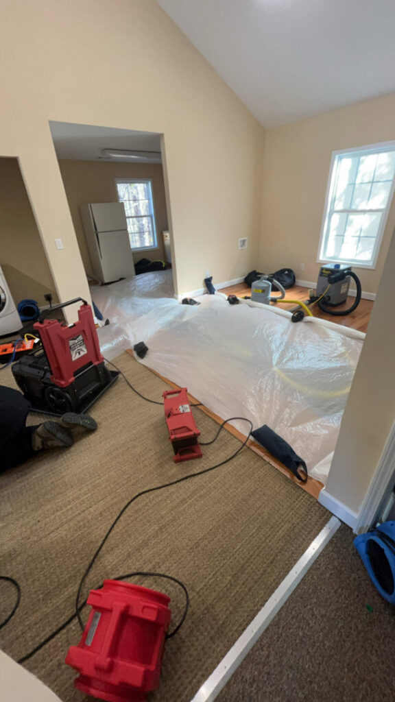 Water damage drying equipment, including air movers and dehumidifiers, set up by Intermountain Cleaning and Restoration in Butte, MT