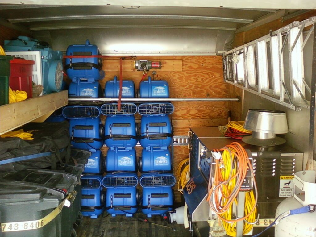 A trailer filled with air movers and drying equipment for water damage restoration by Directed Heat Restoration, Livonia, MI.