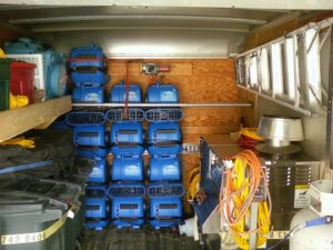 A trailer filled with air movers and drying equipment for water damage restoration by Directed Heat Restoration, Livonia, MI.
