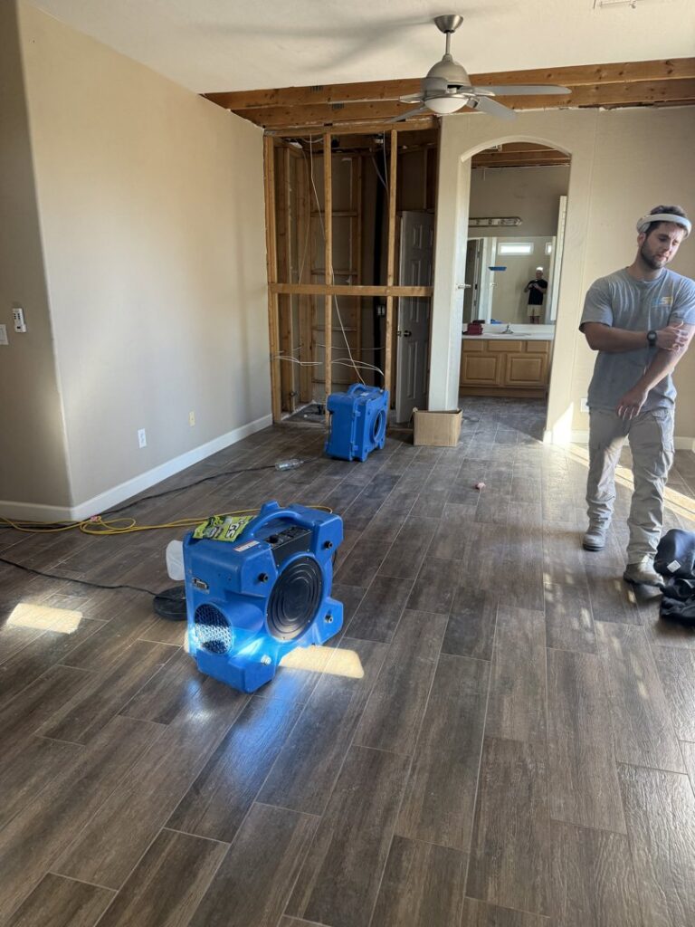 Water damage drying equipment and exposed framing during restoration by Western Skies Restoration in Gilbert, AZ.