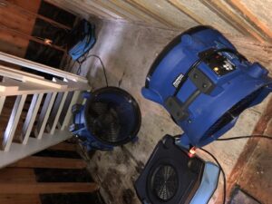 Multiple industrial fans and dehumidifiers set up for water damage drying on a subfloor by Rainbow International of Coeur D'alene in Post Falls, ID