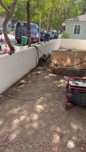 Exposed wall studs and pipes after drywall removal for water damage repair by Duda Plumbing Inc in Cypress, CA.