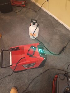 A Flood Force truck loaded with red air movers and other water damage restoration equipment in Dayton, OH.