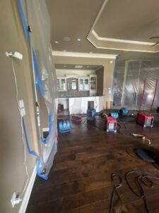 Water damage mitigation equipment, including air movers and containment, deployed by Restoration Xperts Emergency 24/7 in Deerfield Beach, FL.