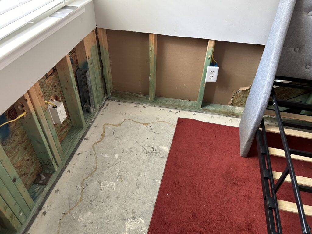 Water damage remediation in a room with removed drywall and exposed studs by PuroClean Disaster Restoration of Charleston, SC.