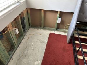 Water damage remediation in a room with removed drywall and exposed studs by PuroClean Disaster Restoration of Charleston, SC.