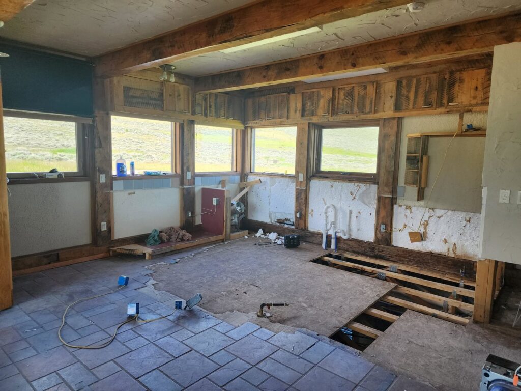 An interior room undergoing water damage remediation with flooring and walls removed by 406 Disaster Response in Billings, MT.