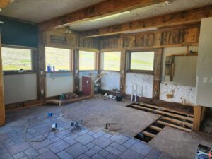 An interior room undergoing water damage remediation with flooring and walls removed by 406 Disaster Response in Billings, MT.