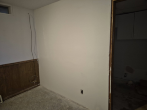 Water damage remediation, removed carpet, stained concrete floor by Risen Handyman services LLC, Council Bluffs, IA.