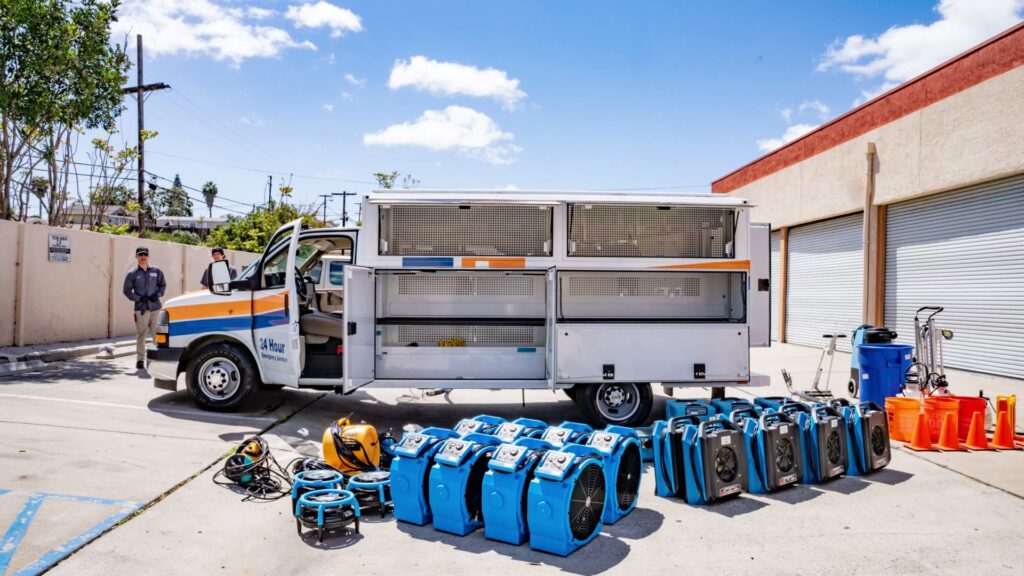 A wide array of water damage restoration equipment, including many air movers, displayed by Certified Restoration in San Diego, CA