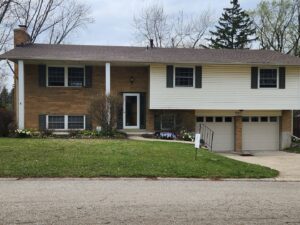 Specialized equipment, including a large fan and dehumidifier, is actively drying a water-damaged area by Johnson Restoration in Centerville, OH.