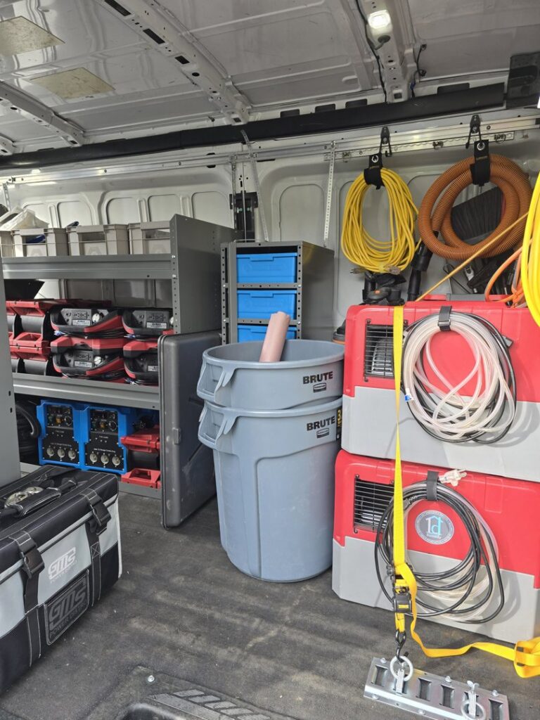 Interior of a 1d Remedy LLC service van showing water damage restoration equipment and tools in Mechanicsburg, PA
