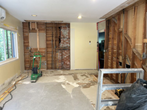 A room undergoing water damage restoration with walls removed and drying equipment by Advanced Recovery of the Midwest in Leavenworth, KS.