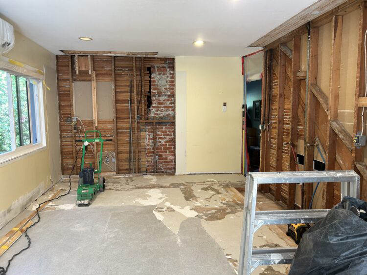 A room undergoing water damage restoration with walls removed and drying equipment by Advanced Recovery of the Midwest in Leavenworth, KS.