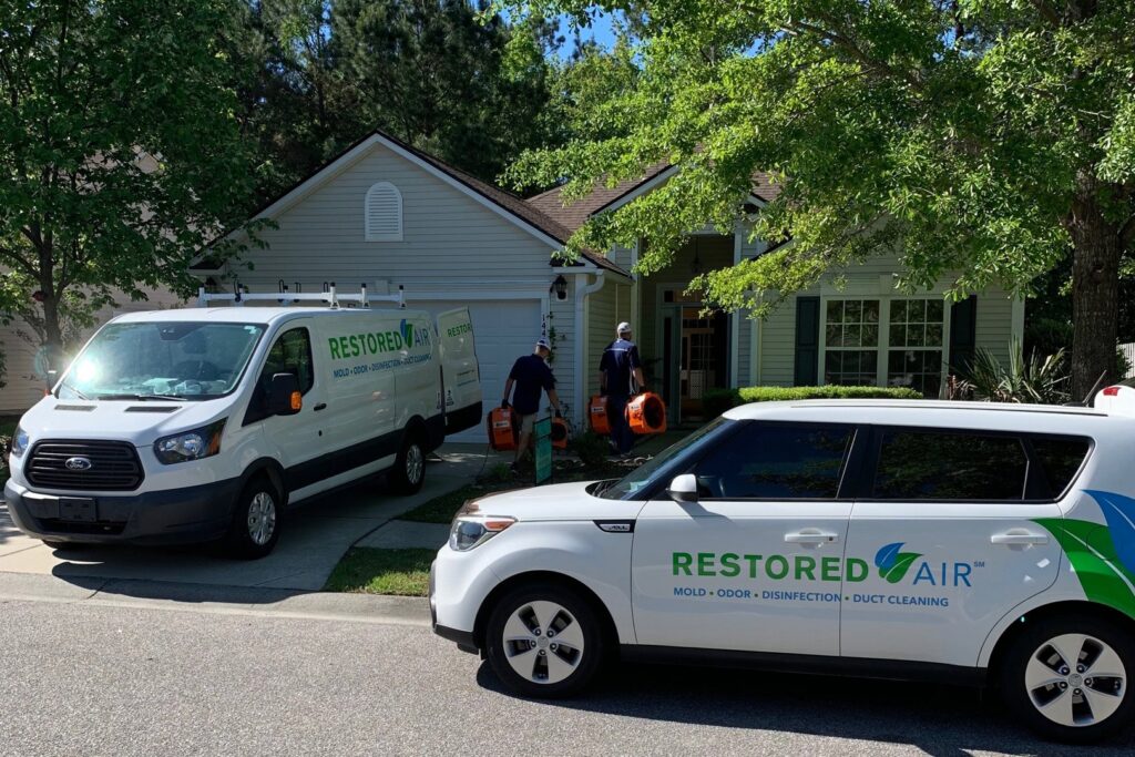 Restored Air water damage specialists arriving at a residential job site with equipment in Summerville, SC.