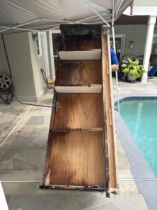 A piece of water-damaged cabinetry removed from a property by Triangle Restoration in Raleigh, NC.