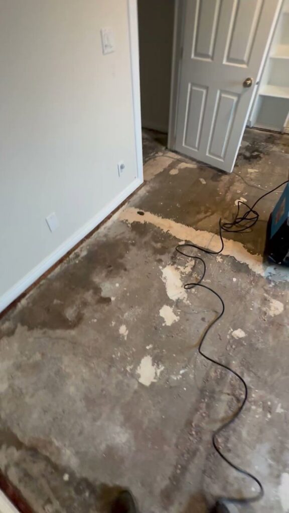 A water-damaged floor after carpet removal, showing the extent of the damage, handled by Idaho Disaster Pros in Idaho Falls, ID.