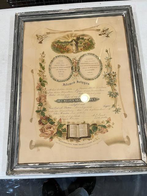 A framed document showing clear water damage on its frame and matting, restored by Square One Restoration, Inc. in Tempe, AZ.