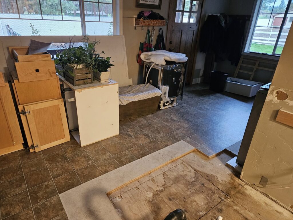 A water-damaged kitchen floor with subfloor exposed during restoration by Servpro of Bend in Bend, OR