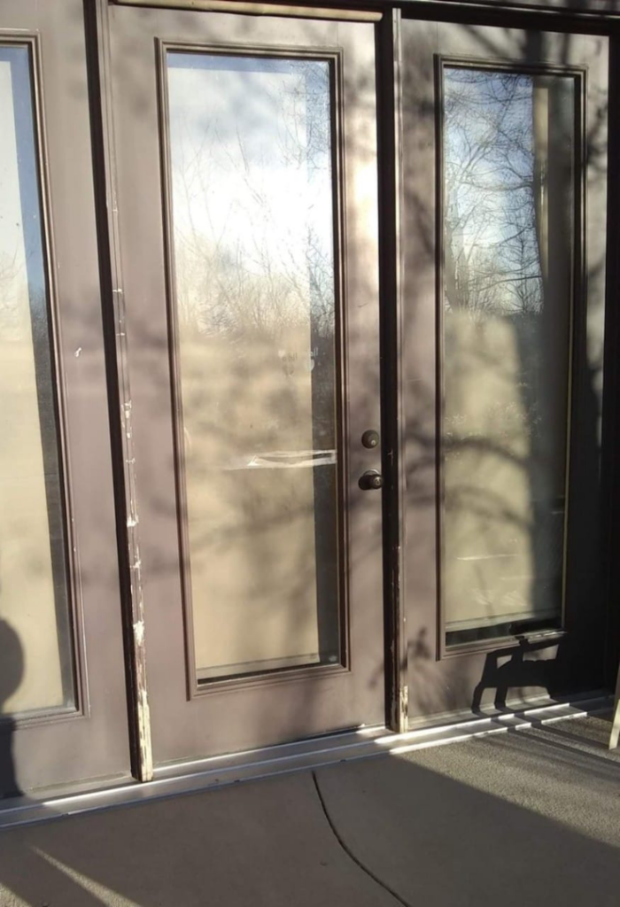 Exterior patio doors showing peeling paint and water damage, restored by R&R Residential Restoration & Customization in Casper, WY.
