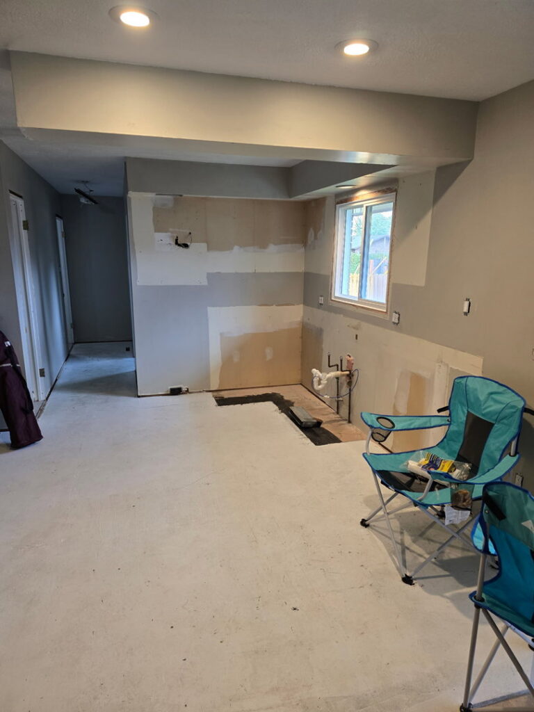 A room with removed drywall and exposed studs during water damage demolition by Dayspring Restoration in Butte, MT