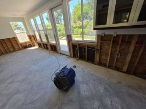 Water damaged walls removed with drying equipment in use by Risk Free Serv Water Damage Repair San Diego, CA