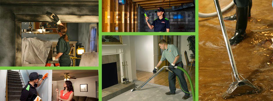A SERVPRO technician performing water extraction from a heavily flooded floor, demonstrating water damage restoration in Alexandria, LA.