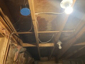 Clear water stains visible on wooden ceiling joists, indicating water damage addressed by Gold Star Services LLC in Newark, DE