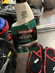 A bottle of Weiman Disinfectant Granite & Stone cleaner used by Danielle's cleaning service in Xenia, OH