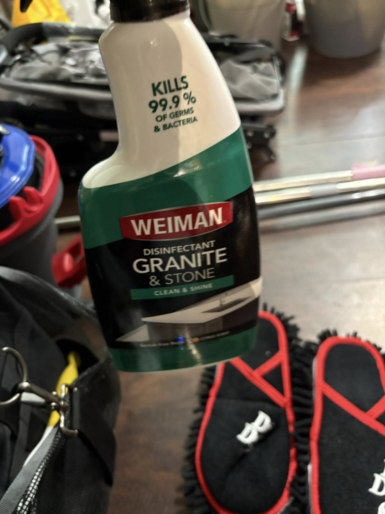 A bottle of Weiman Disinfectant Granite & Stone cleaner used by Danielle's cleaning service in Xenia, OH