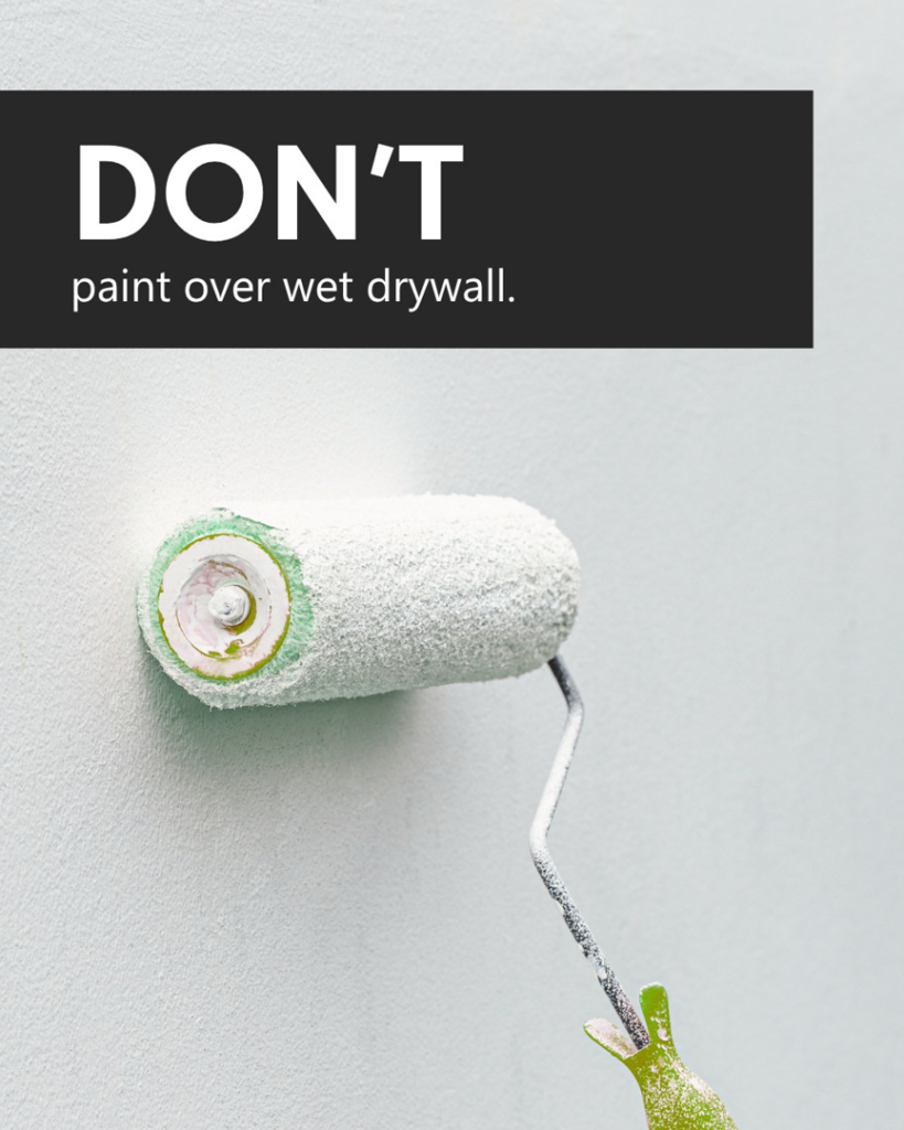 A paint roller on a wall, illustrating the warning not to paint over wet drywall, a service handled by PatchMaster Central Connecticut in Bristol, CT.