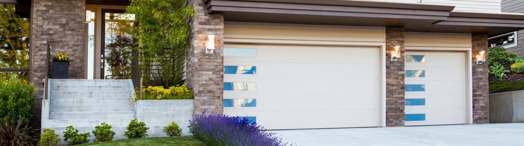 Interior view of a white garage door, showing tracks and opener mechanism, installed by Custom Overhead Doors of Southern New Mexico in Alamogordo, NM.