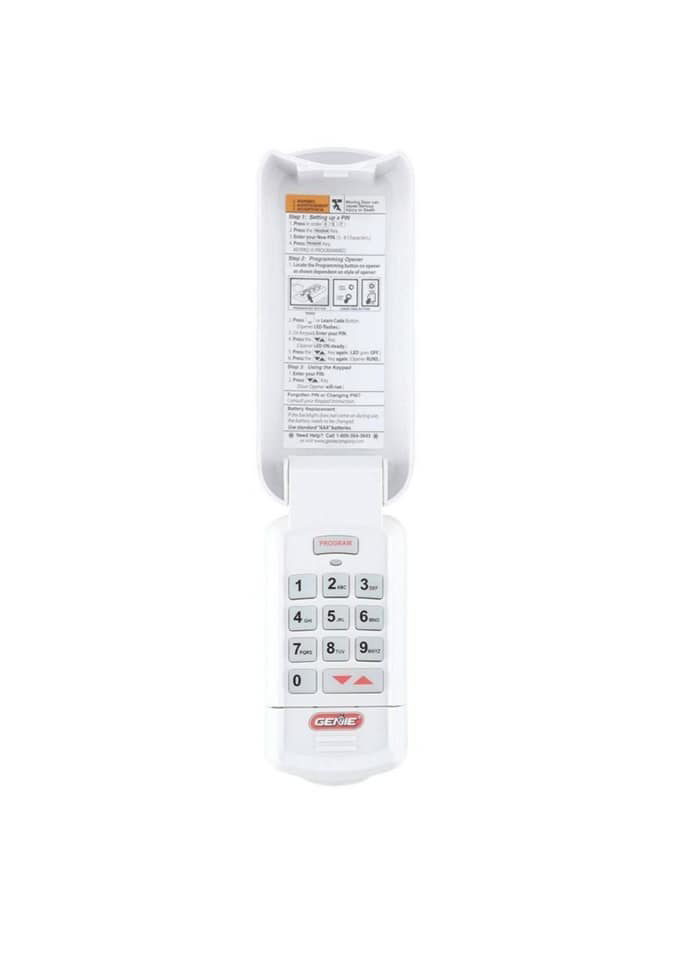 A white garage door keypad with programming instructions from Frontier Garage Door in Anchorage, AK.